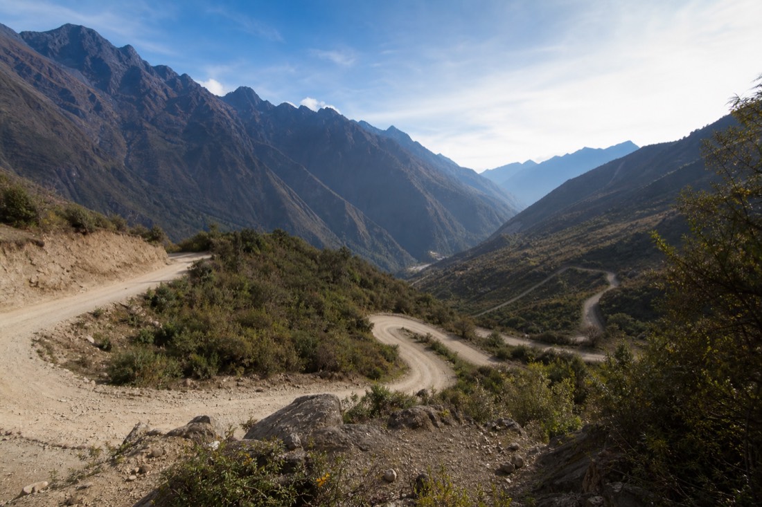 Unpaved switchback road between Mollepata and Soraypampa with the Salkantay valley behind